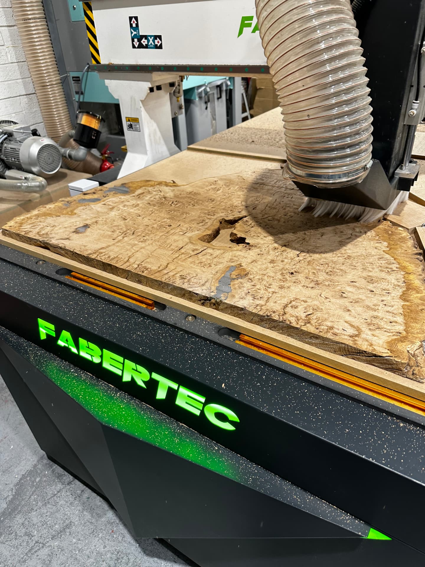 Burr oak board being machined on the CNC in the workshop