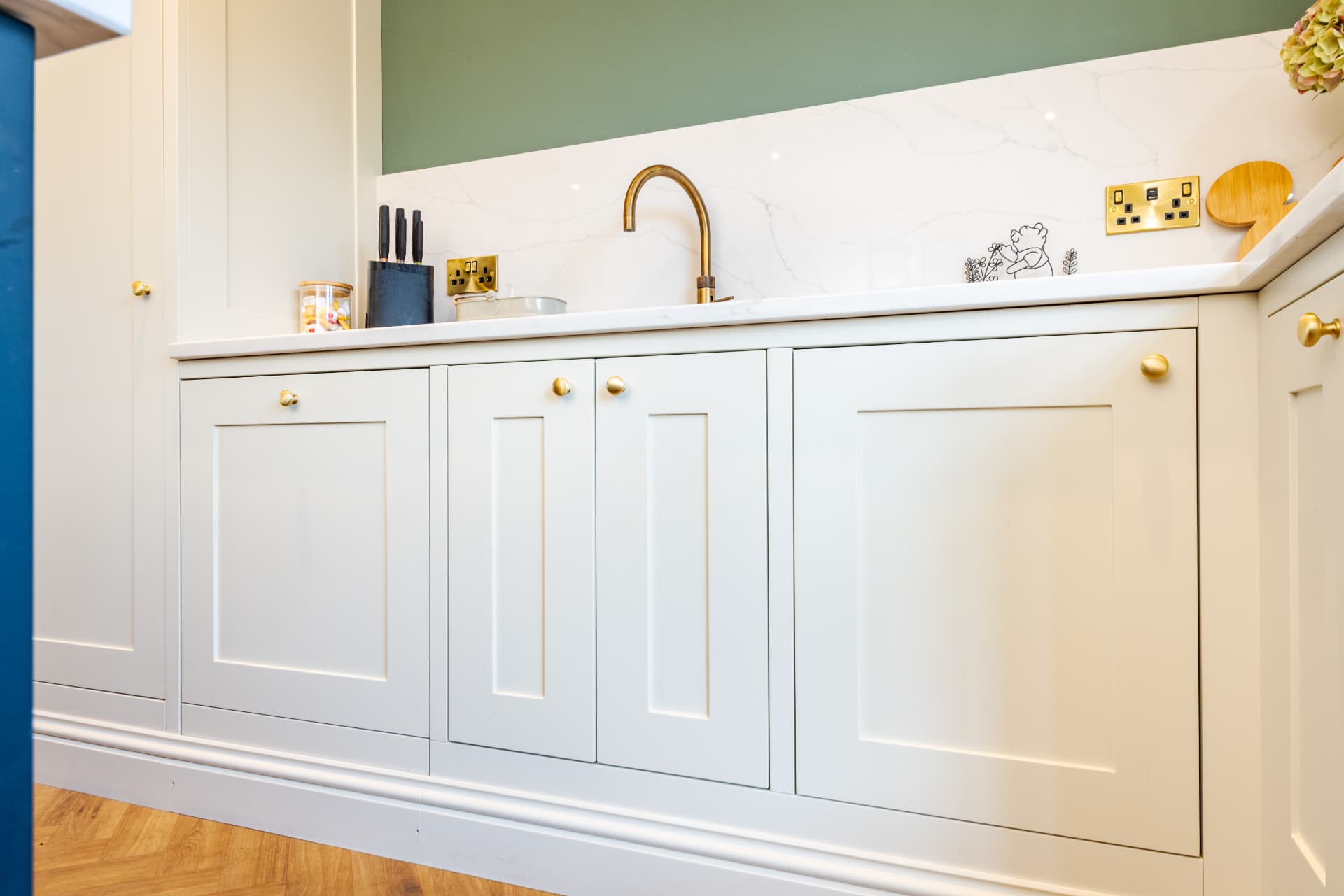 Handmade cream shaker kitchen with brass handles, built by Webb Bespoke Interiors